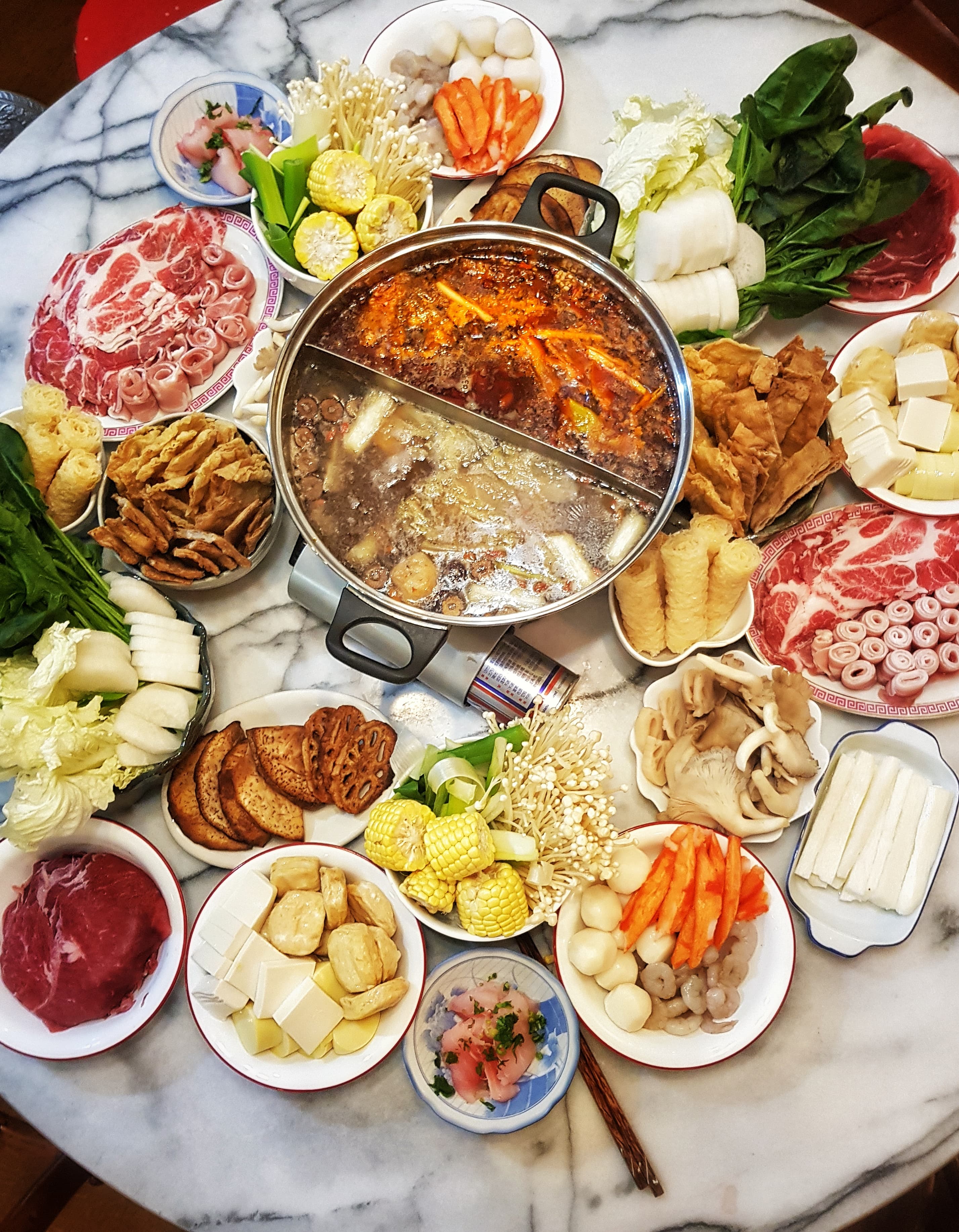 Chongqing hot pot — a people's republic of china cuisine main course dish from People's Republic of China — featuring communal cooking, mala spice-and-numbing, dip-and-eat