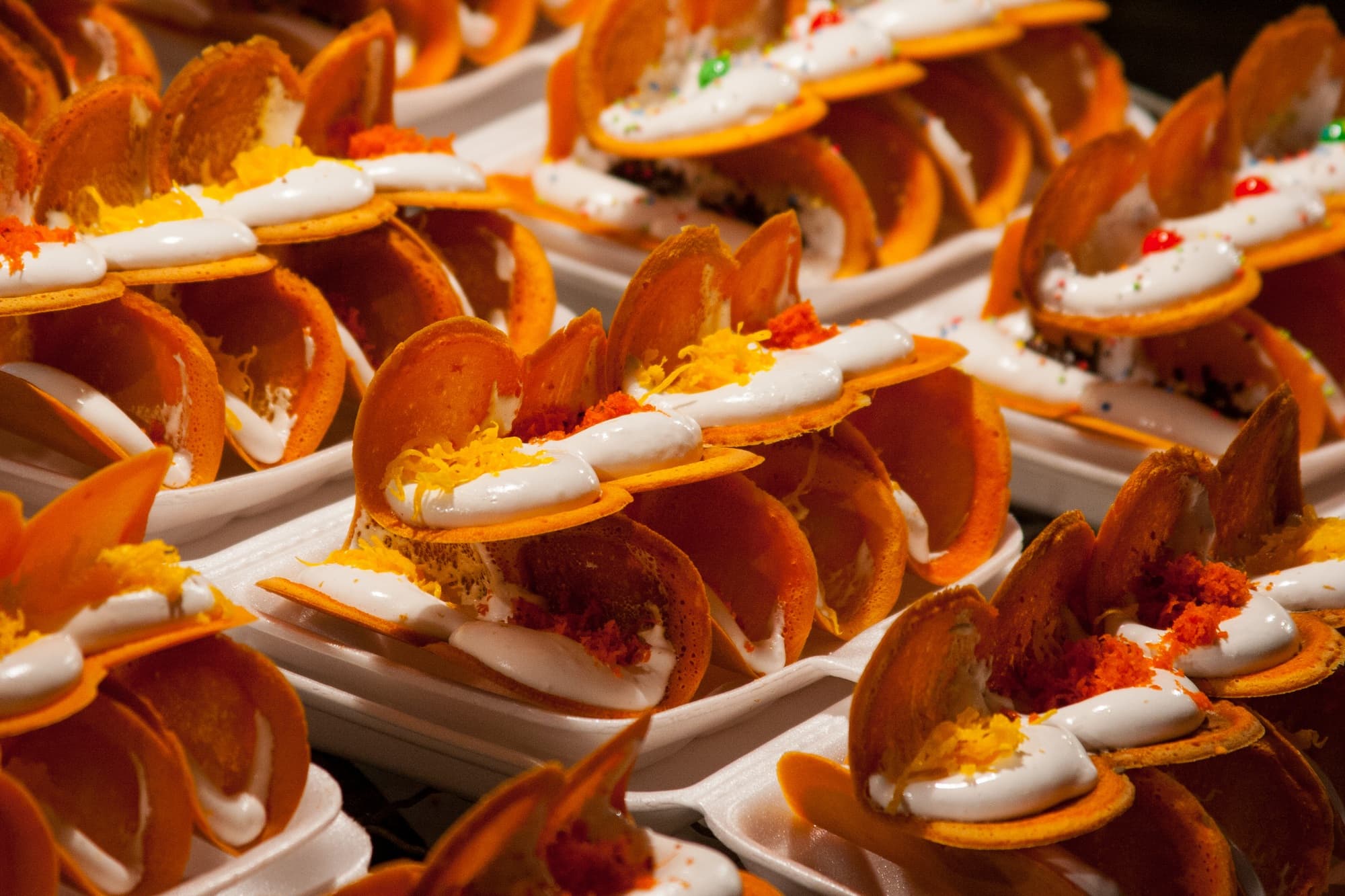 Khanom bueang — a thai street food dish from Thailand — featuring crispy shell, meringue-filled, street food