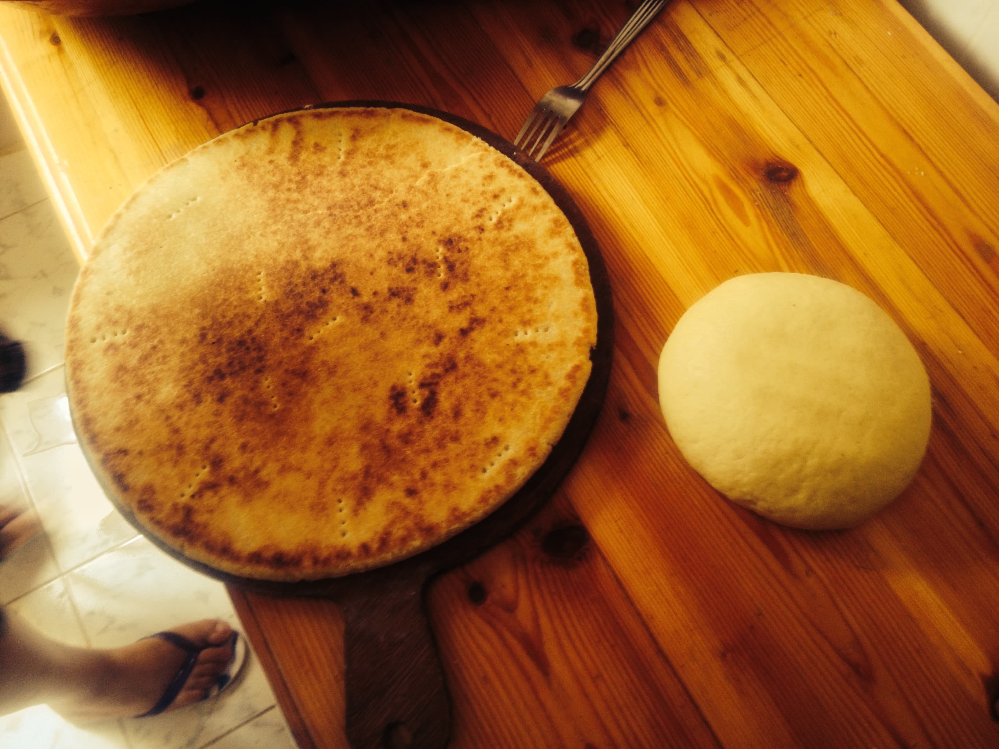 Kesra (bread) — a algerian main course dish from Algeria — featuring griddle-cooked, semolina-based, regional variations