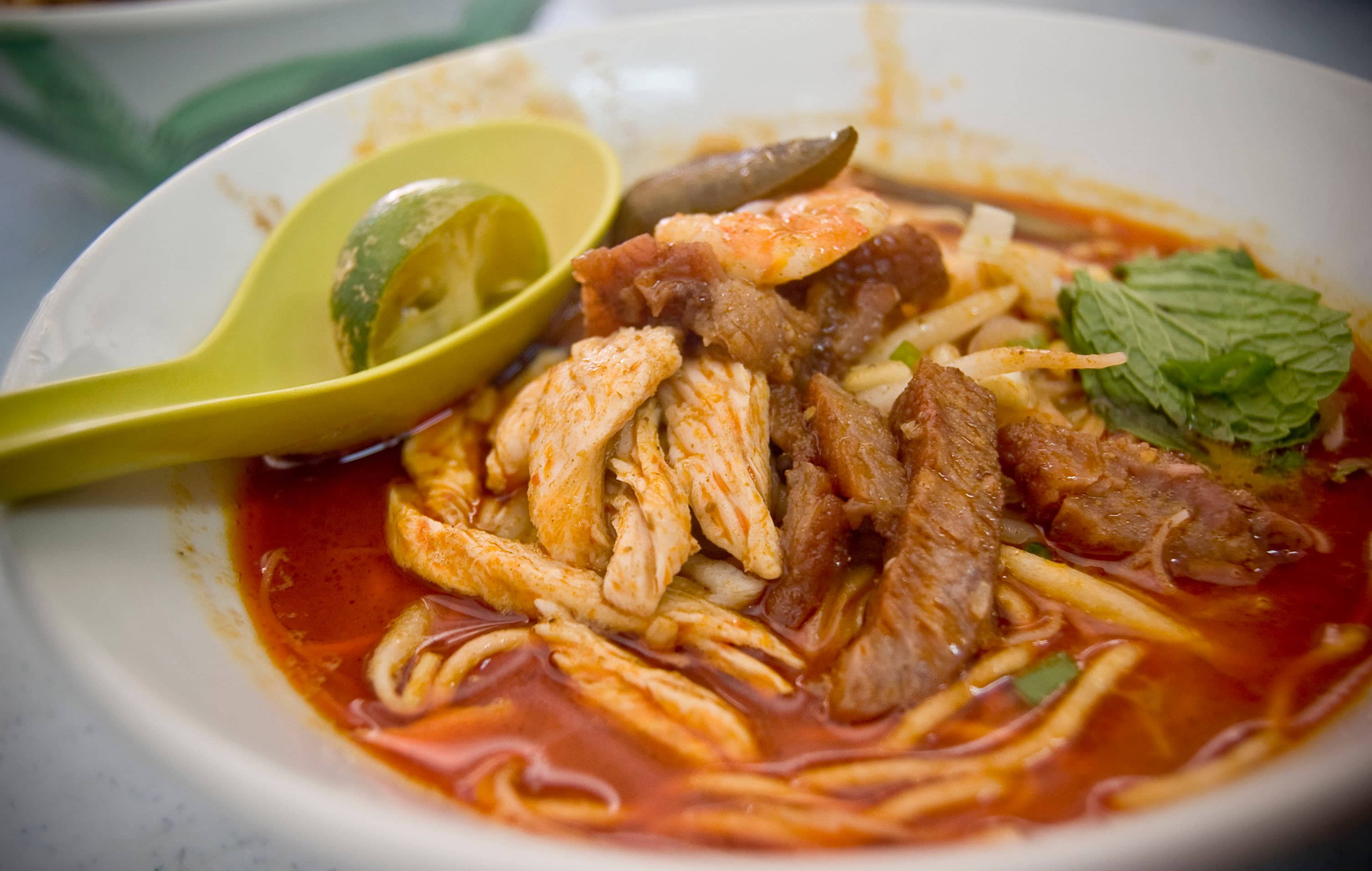Curry mee — a malaysian main course dish from Malaysia — featuring coconut-milk broth, spiced, noodle soup