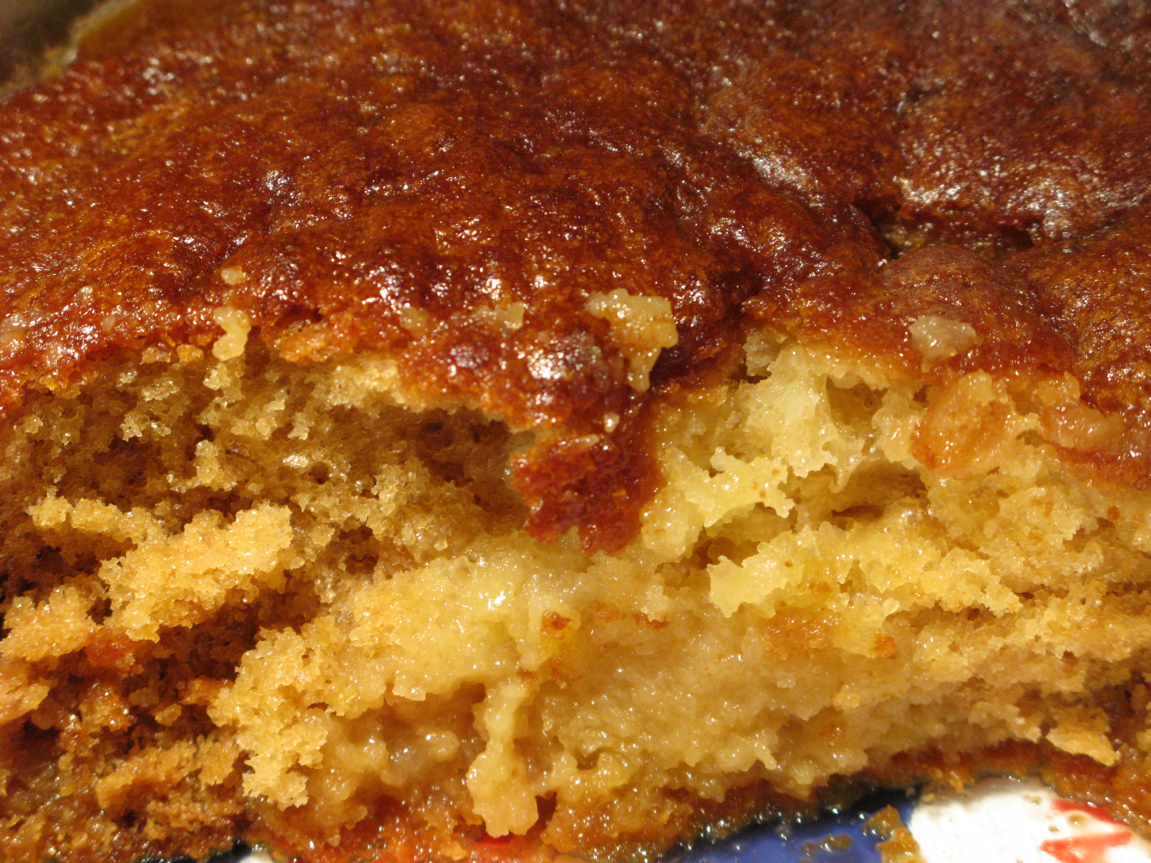 Malva pudding — a south african main course dish from South Africa — featuring baked cake-pudding hybrid, apricot jam centre, caramelised sponge