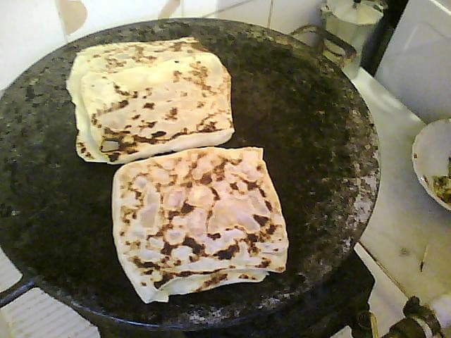 Mahdjouba — a algerian main course dish from Algeria — featuring crepe-like texture, semolina-based, vegetable-filled