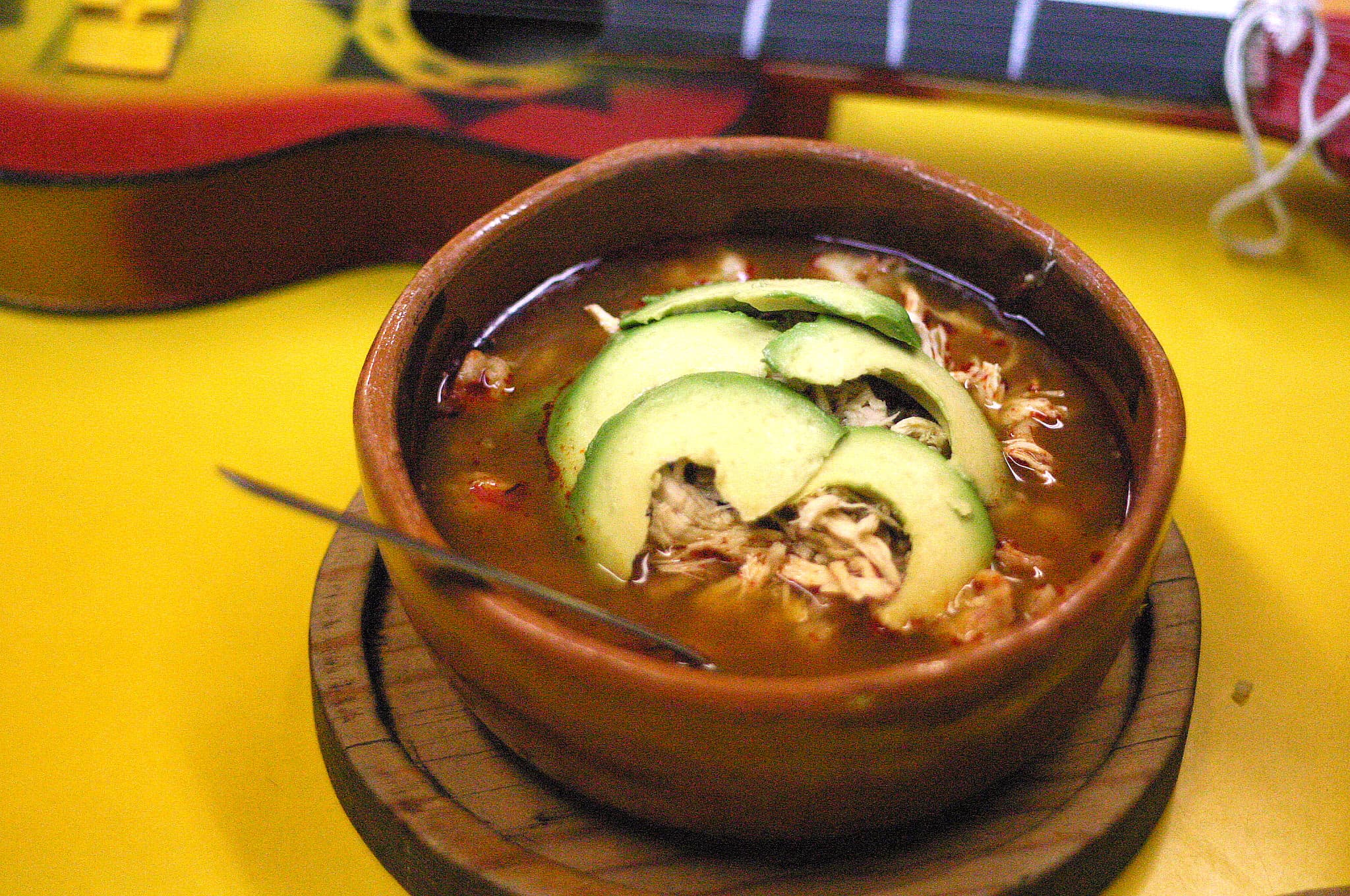 Pozole — a mexican main course dish from Mexico — featuring hominy-based, slow-cooked stew, customizable toppings