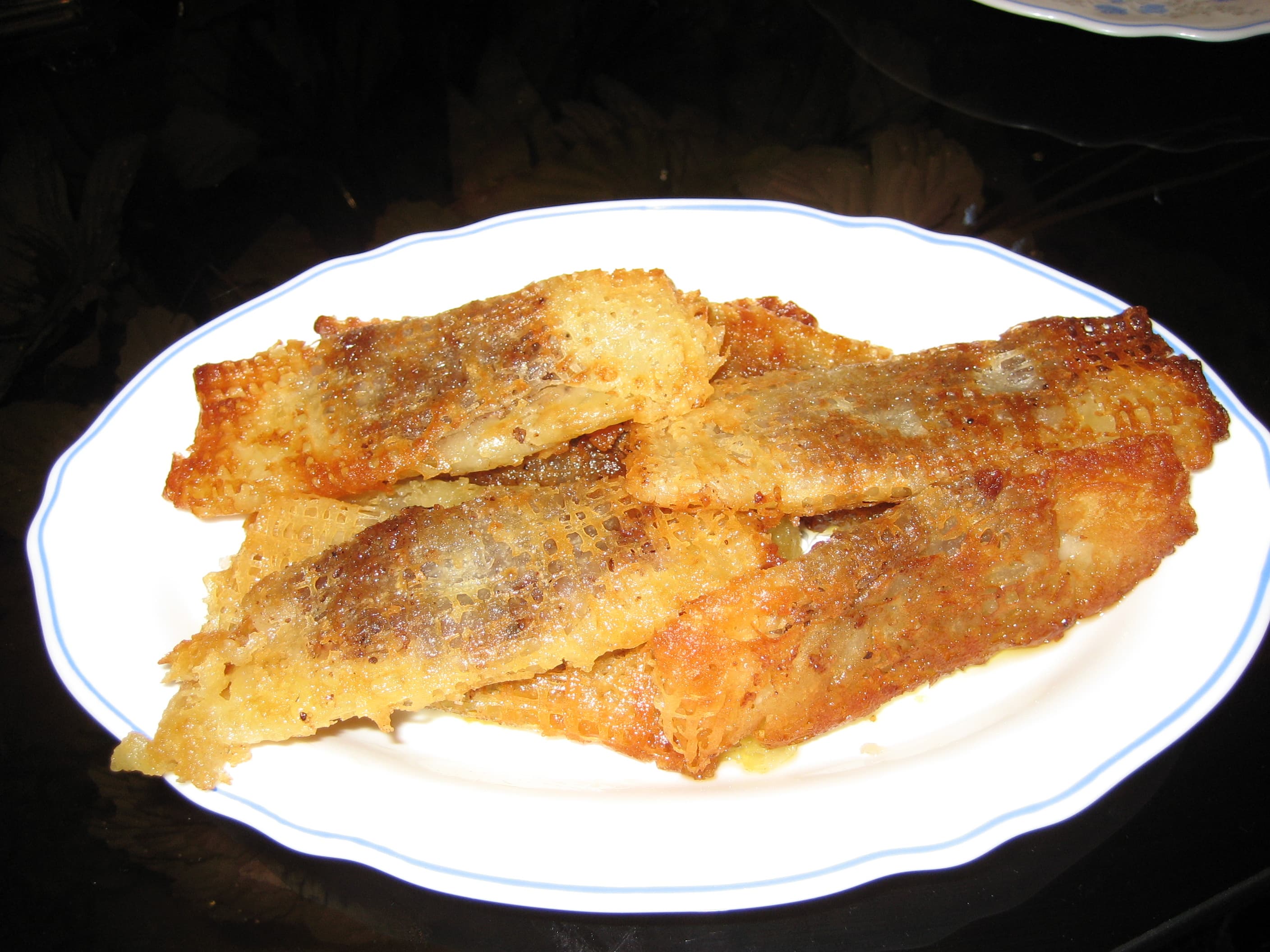 Reshteh khoshkar — a iranian main course dish from Iran — featuring piped pastry, walnut-filled, spiced