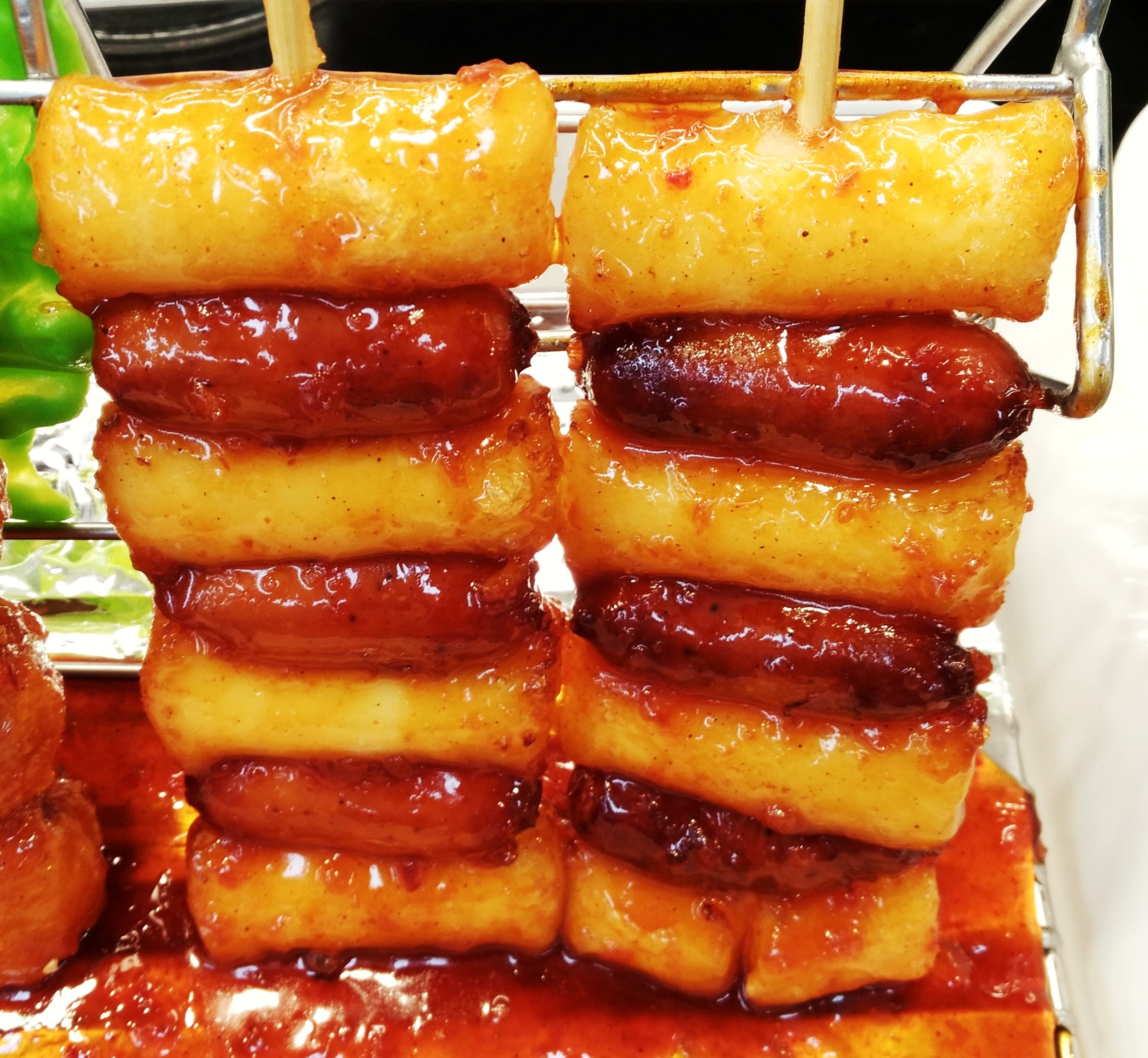 So-tteok-so-tteok — a korean street food dish from South Korea — featuring skewered and fried, street food, sweet-spicy sauce