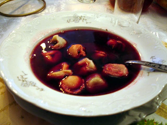 Uszka — a polish main course dish from Poland — featuring hand-twisted shape, wild mushroom-forward, borscht companion