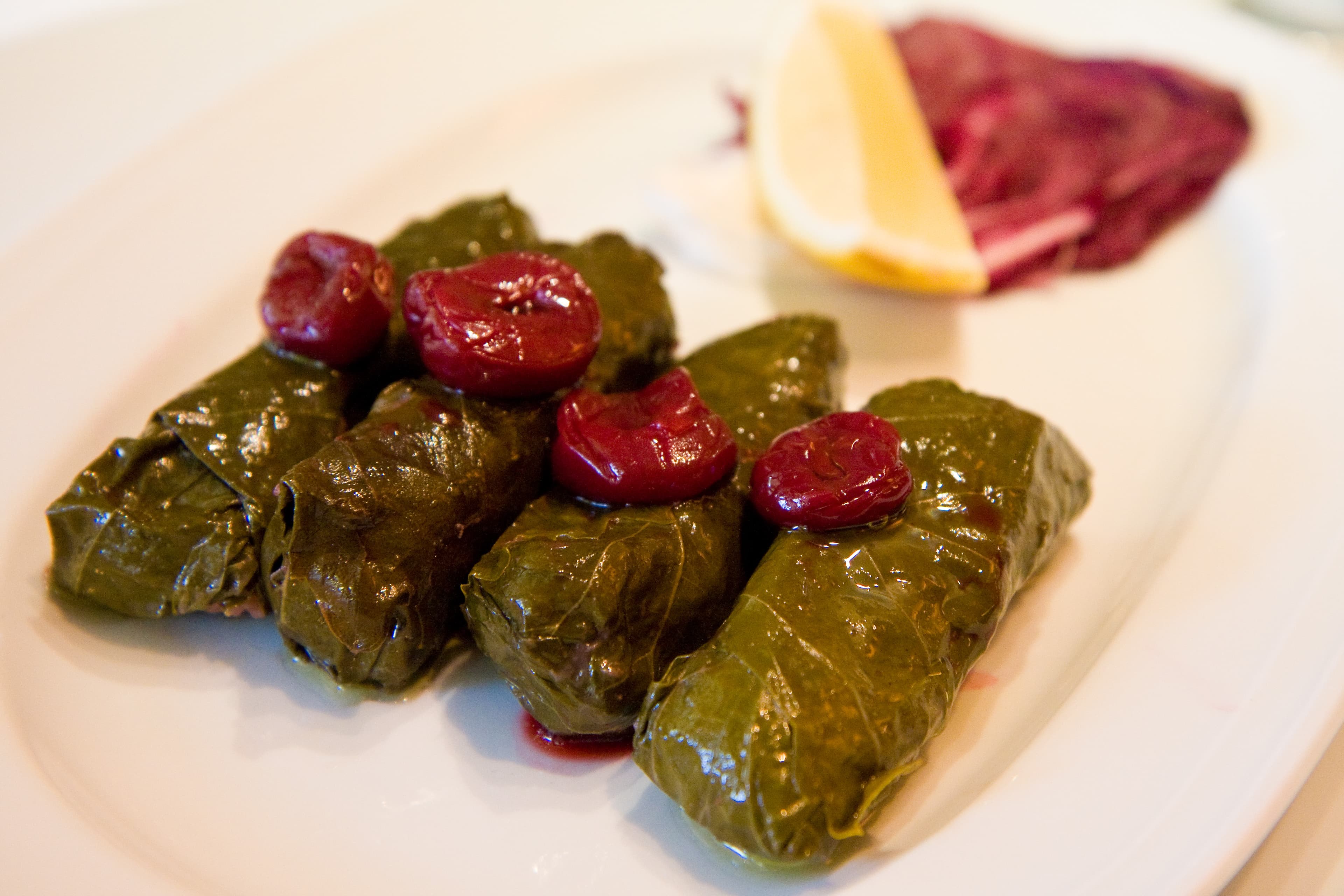 Stuffed leaves — a ottoman empire cuisine main course dish from Ottoman Empire — featuring hand-rolled, leaf-wrapped, meat and grain