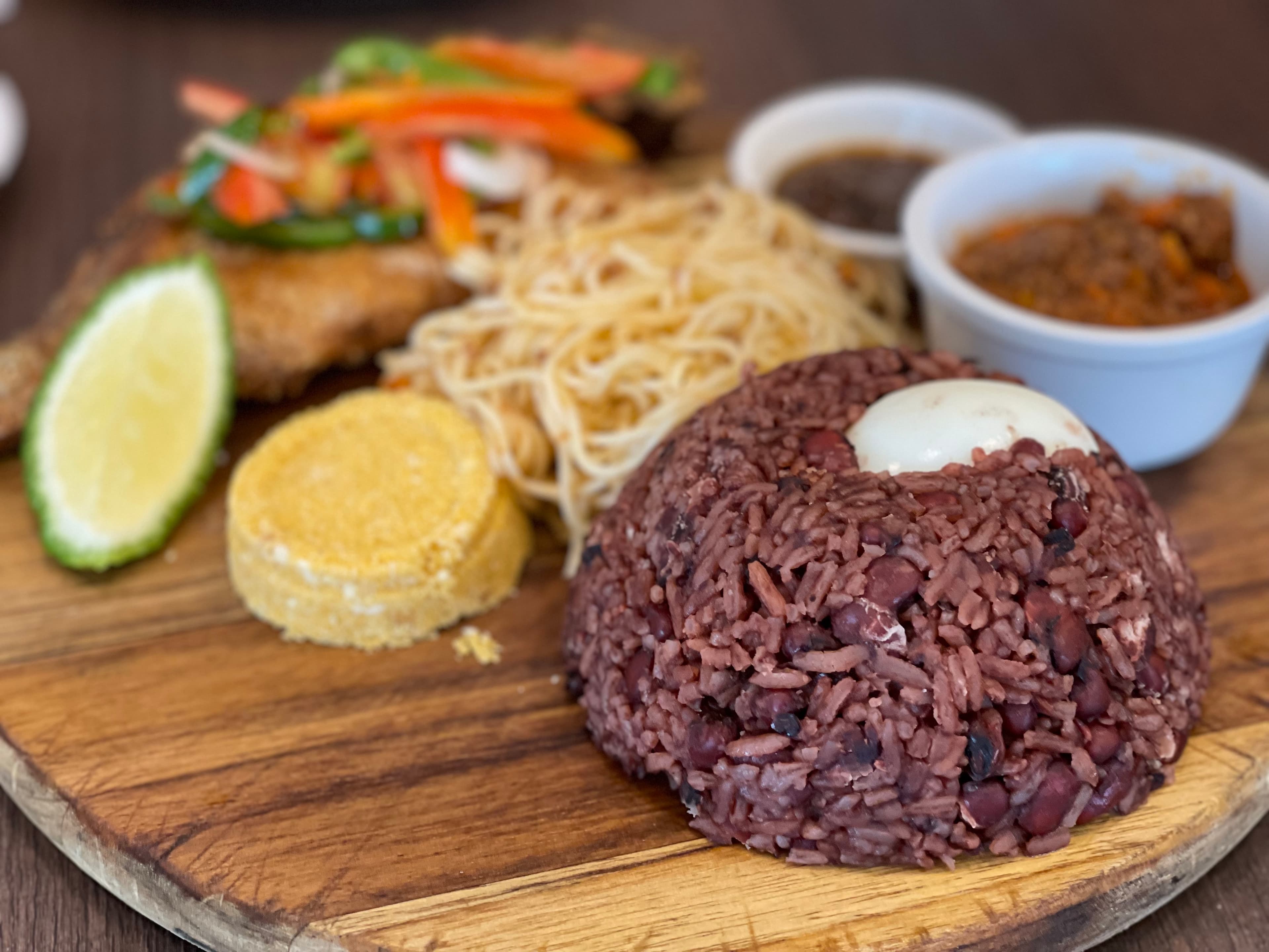 Waakye — a ghanaian breakfast dish from Ghana — featuring rice-and-bean base, sorghum-infused, limestone-brightened