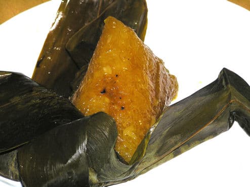 Zongzi — a people's republic of china cuisine main course dish from People's Republic of China — featuring bamboo-wrapped, glutinous rice, dual-flavor tradition